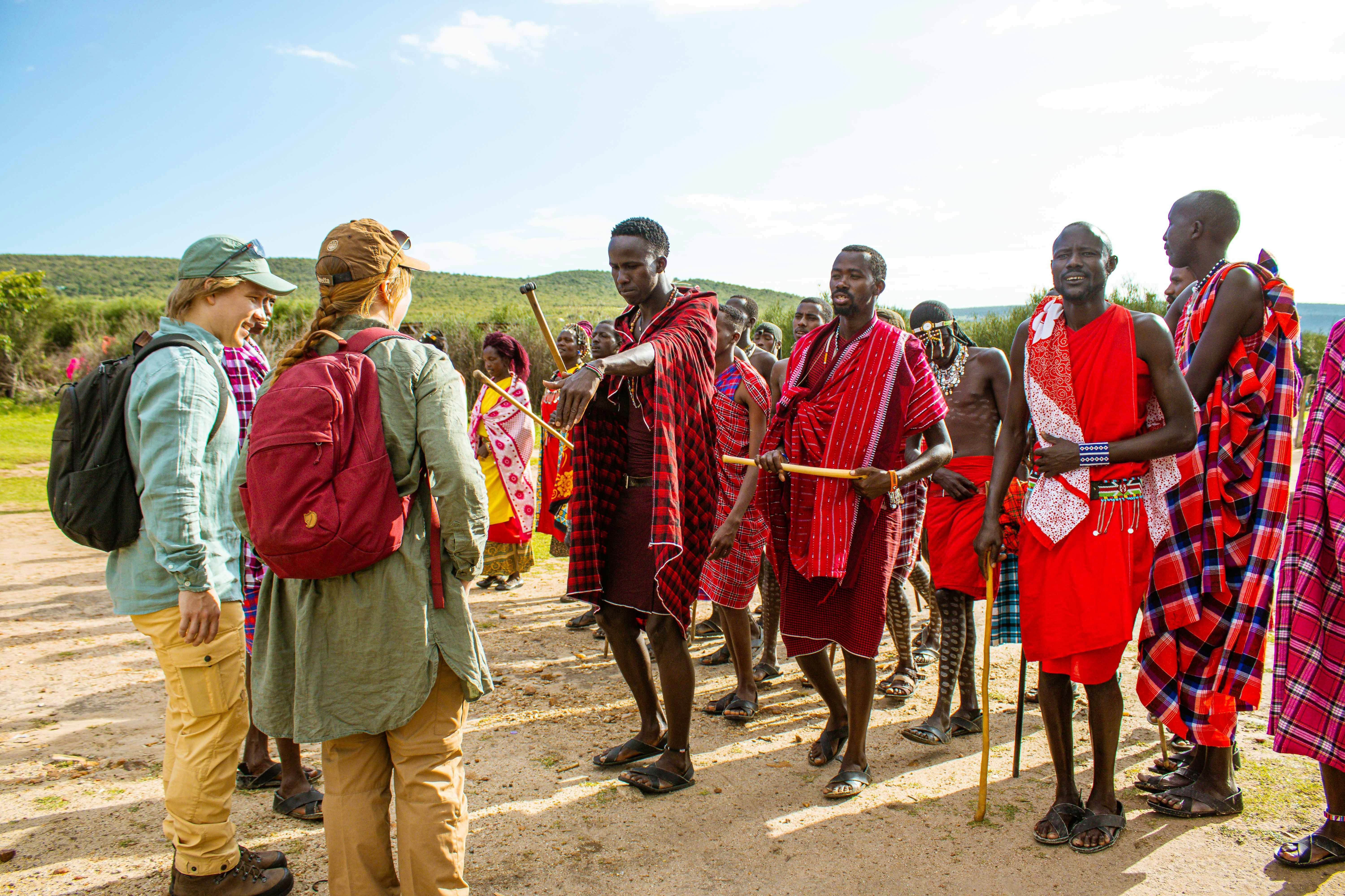 Maasai guides walking in traditional red dress