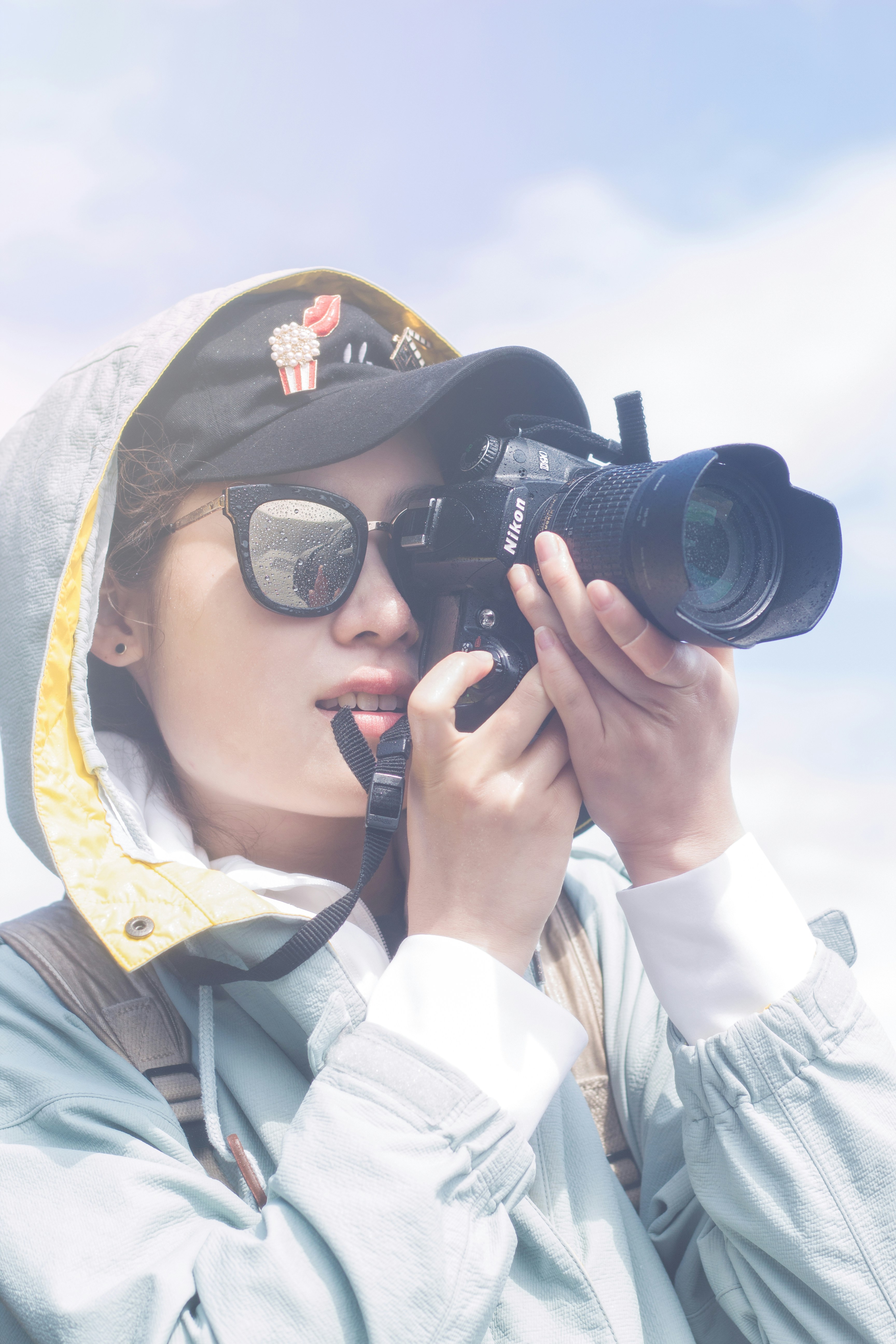 A photographer watching wildlife through a camera