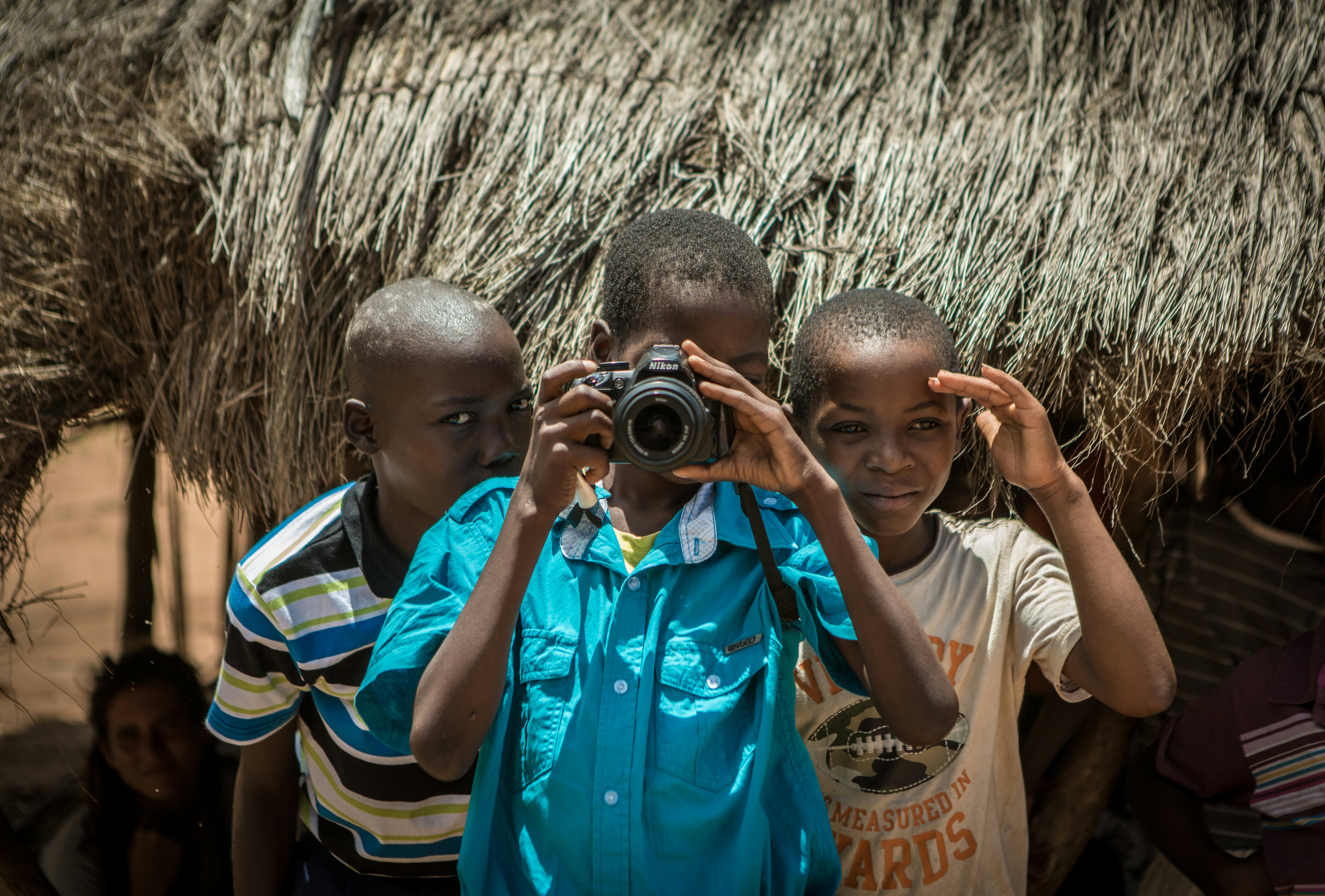 People using binoculars in a forest setting